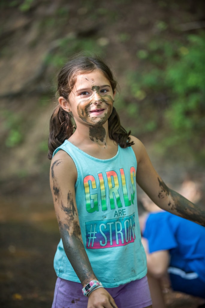 girl covered in mud