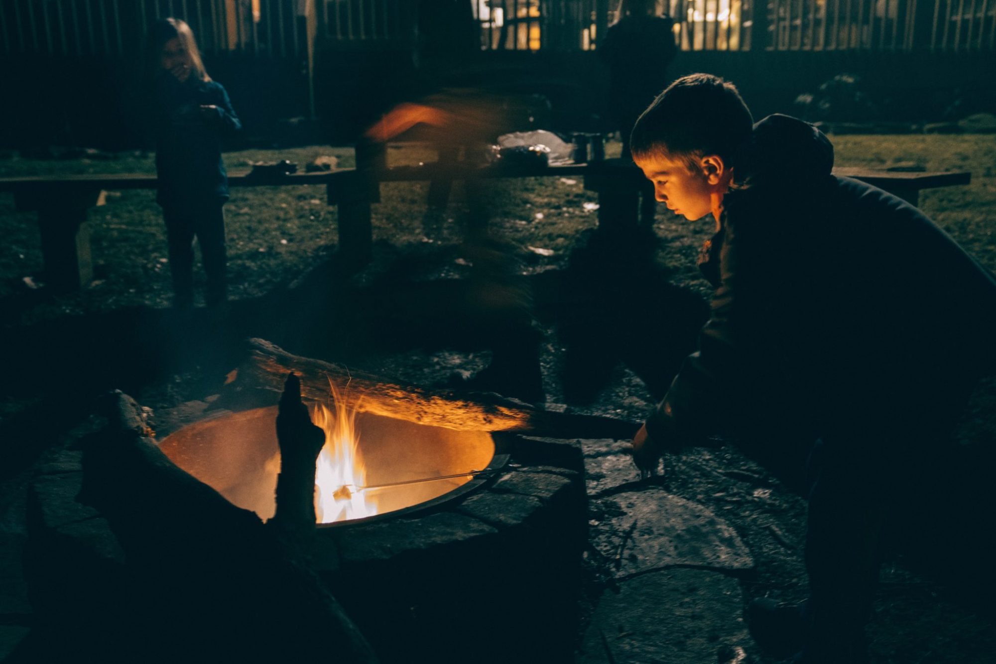 family around campfire